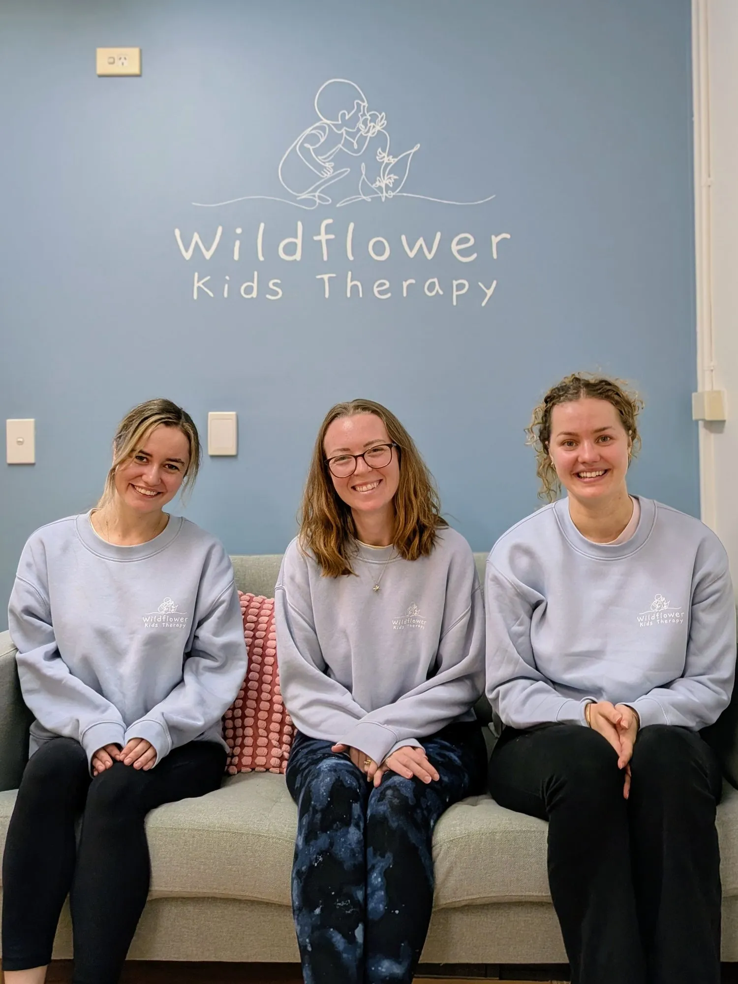 The Wildflower Kids Therapy team on the clinic couch
